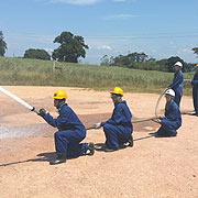 FIRE FIGHTING STUDENTS DEMONSTRATING IN THEIR PRACTICLES
